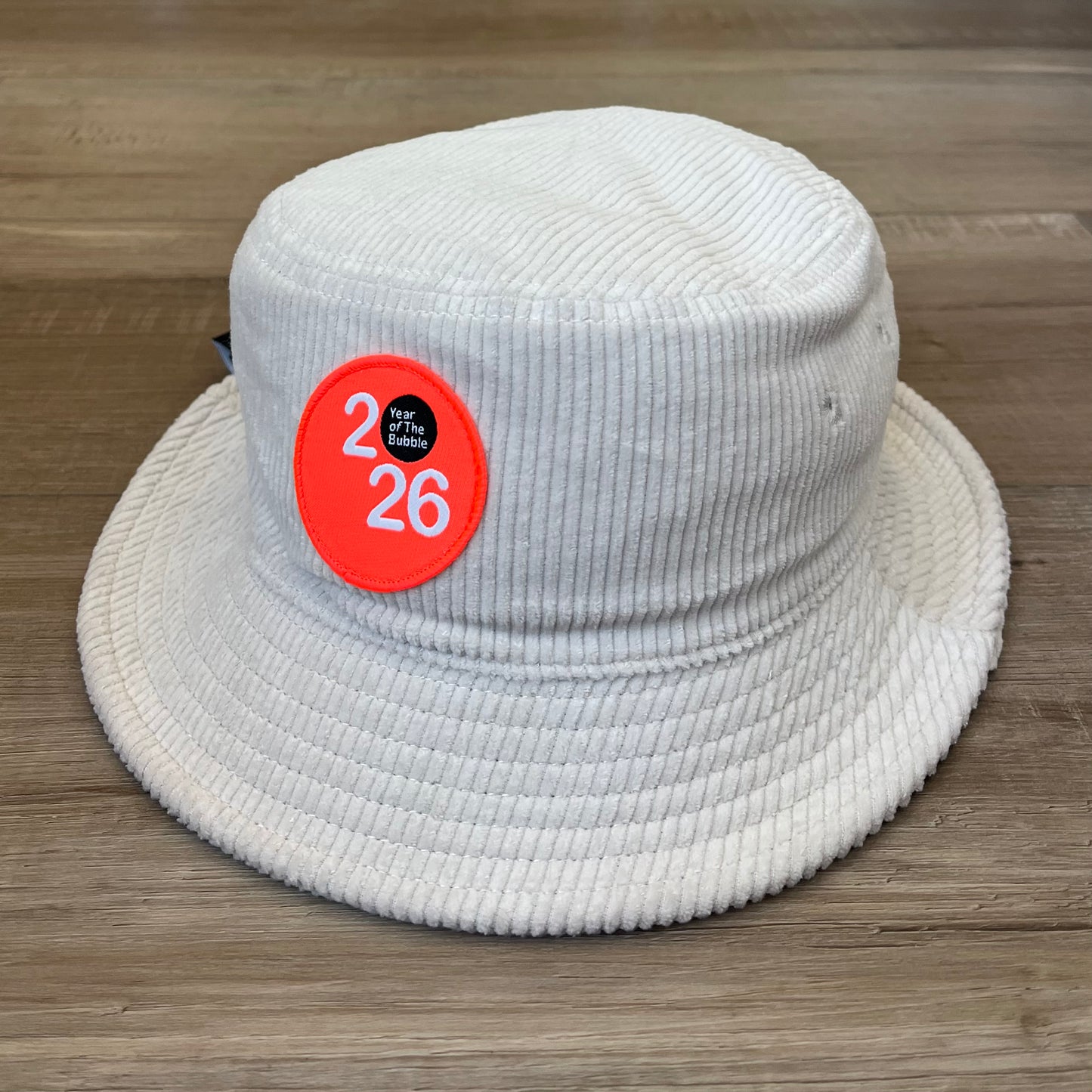 Cord Bucket Hat (Bone with Fluro Orange Badge).